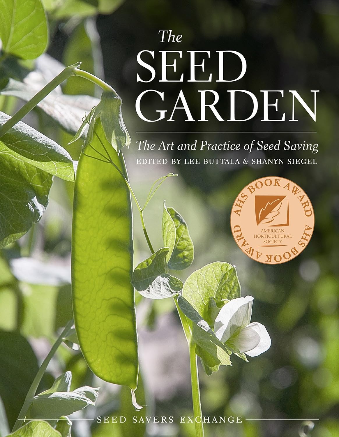 Close-up of a sunlit pea pod on a plant, surrounded by green leaves. The book cover text reads "The Seed Garden," with a gold award seal.