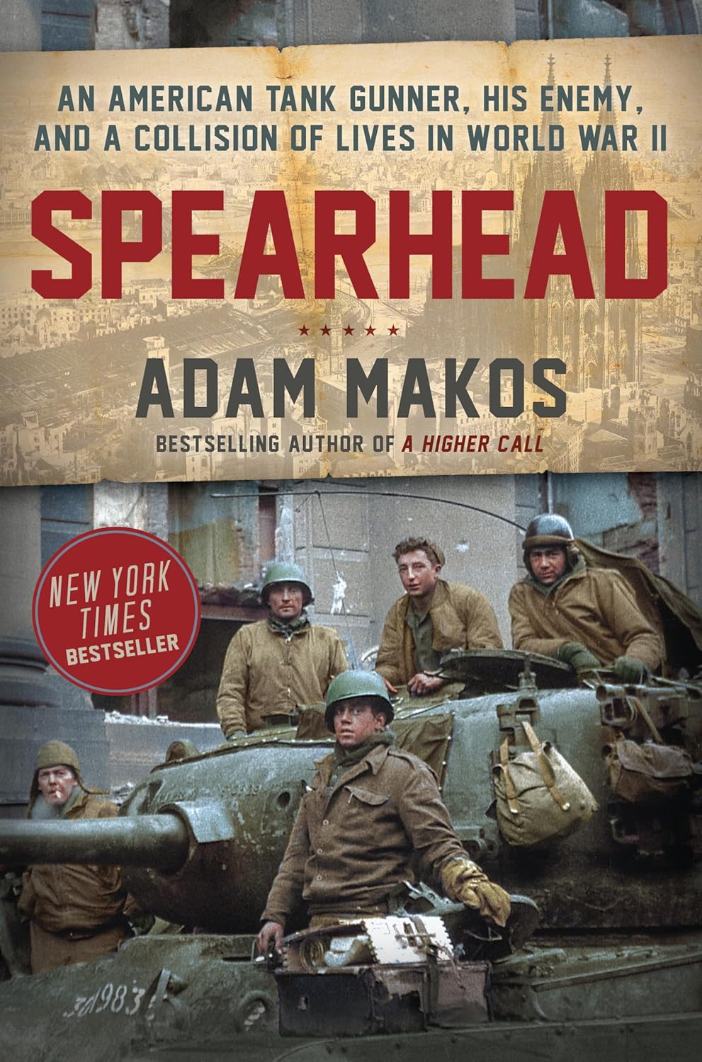 Cover of "Spearhead" by Adam Makos, featuring World War II soldiers on a tank with a backdrop of a war-torn city. Text highlights the author's acclaim.