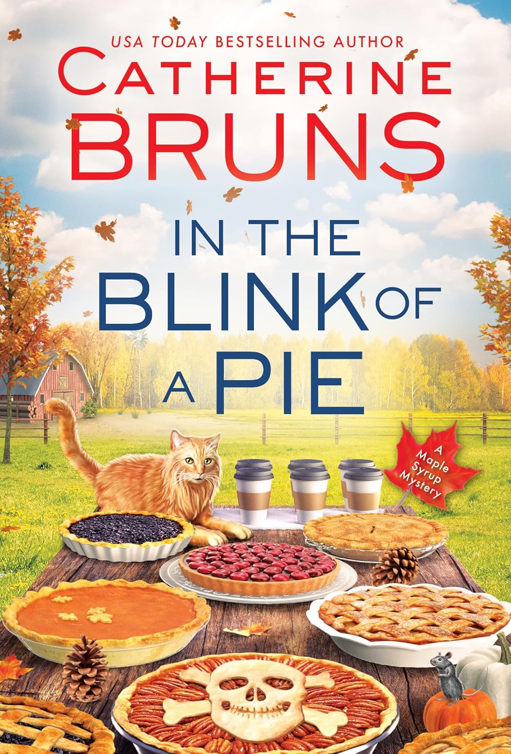 Book cover of "In the Blink of a Pie" by Catherine Bruns. A ginger cat lies on a table surrounded by an array of pies. Autumn leaves and a barn are in the background, creating a cozy fall atmosphere. A badge reads "A Maple Syrup Mystery."